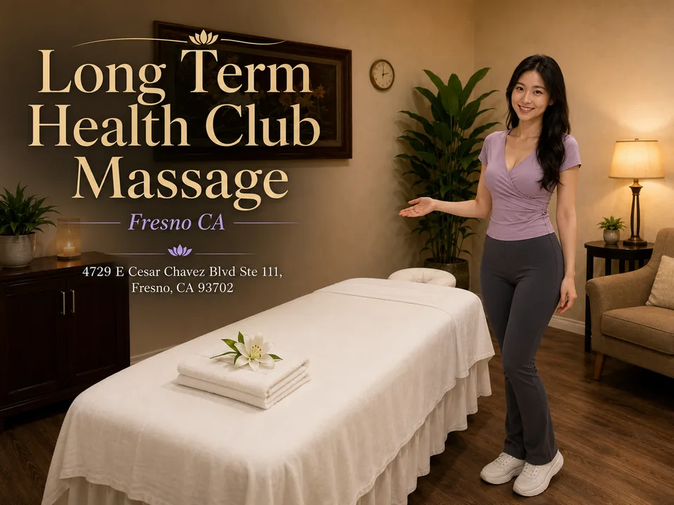 Long Term Health Club Massage therapist welcoming guests in a Fresno treatment room with the spa name and address