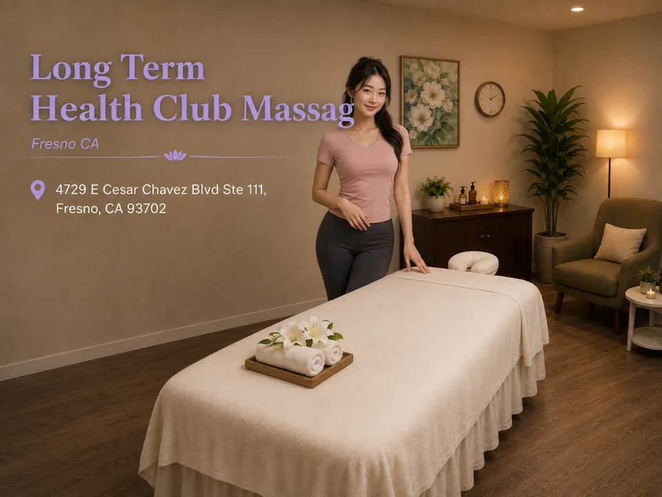 Long Term Health Club Massage therapist welcoming guests in a Fresno treatment room with the spa name and address